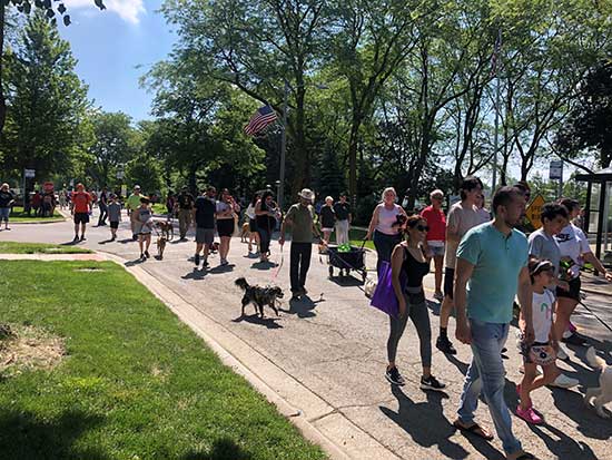 Particpants march in Forest View Pet Parade